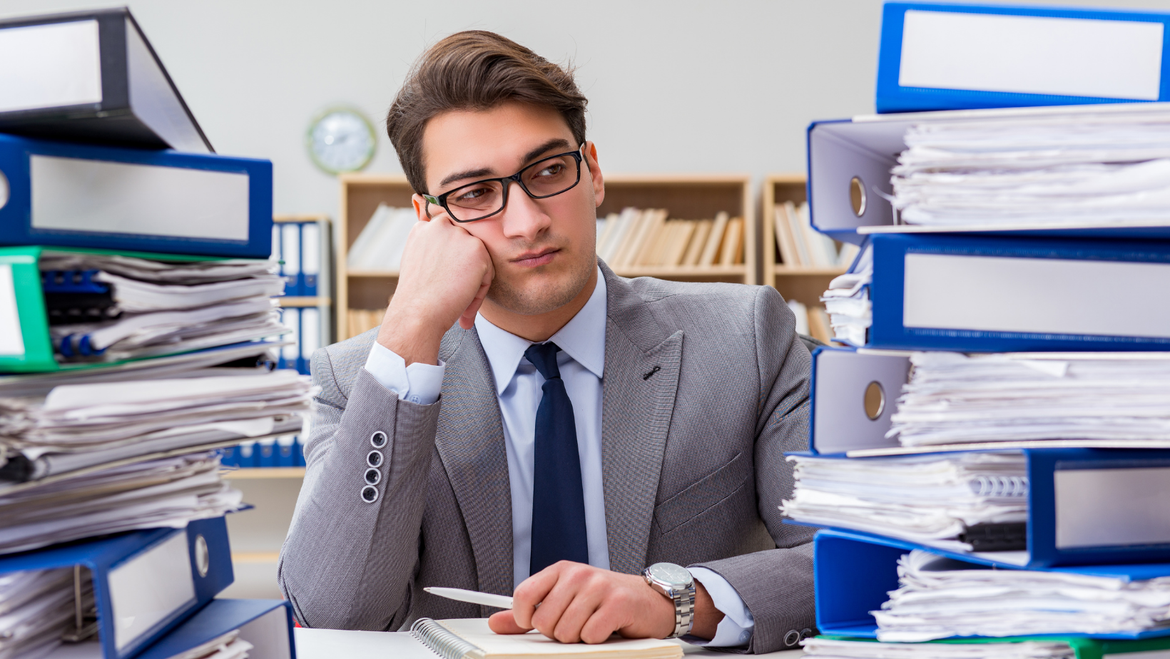 Man struggling with too much work